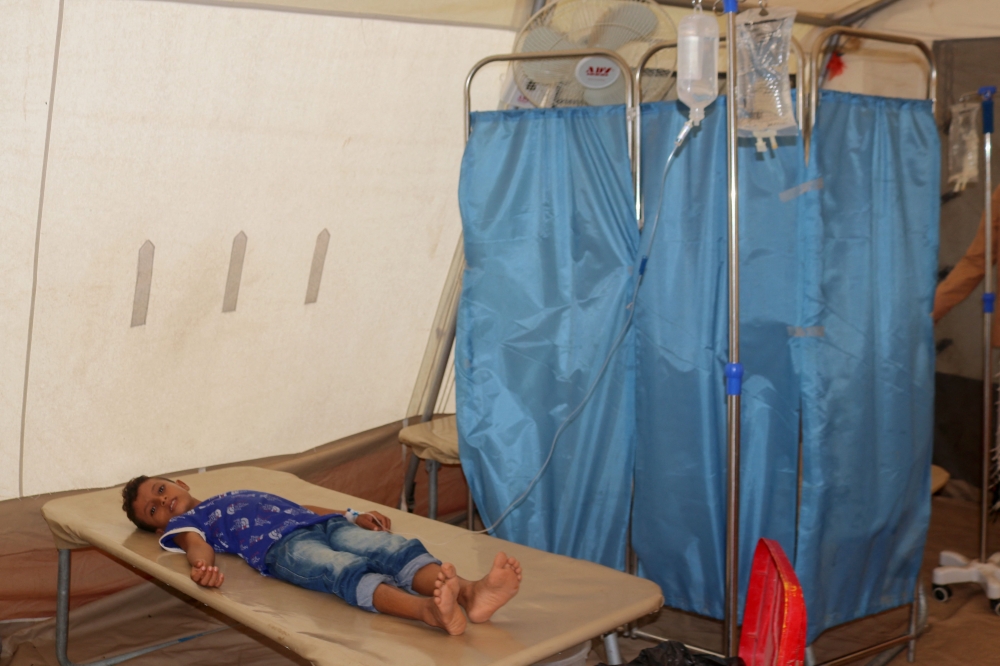 Cholera patients receive treatment at a clinic in the Hays region, south of Yemen's Hodeidah Governorate on August 21, 2024. Photo by Khaled ZIAD / AFP