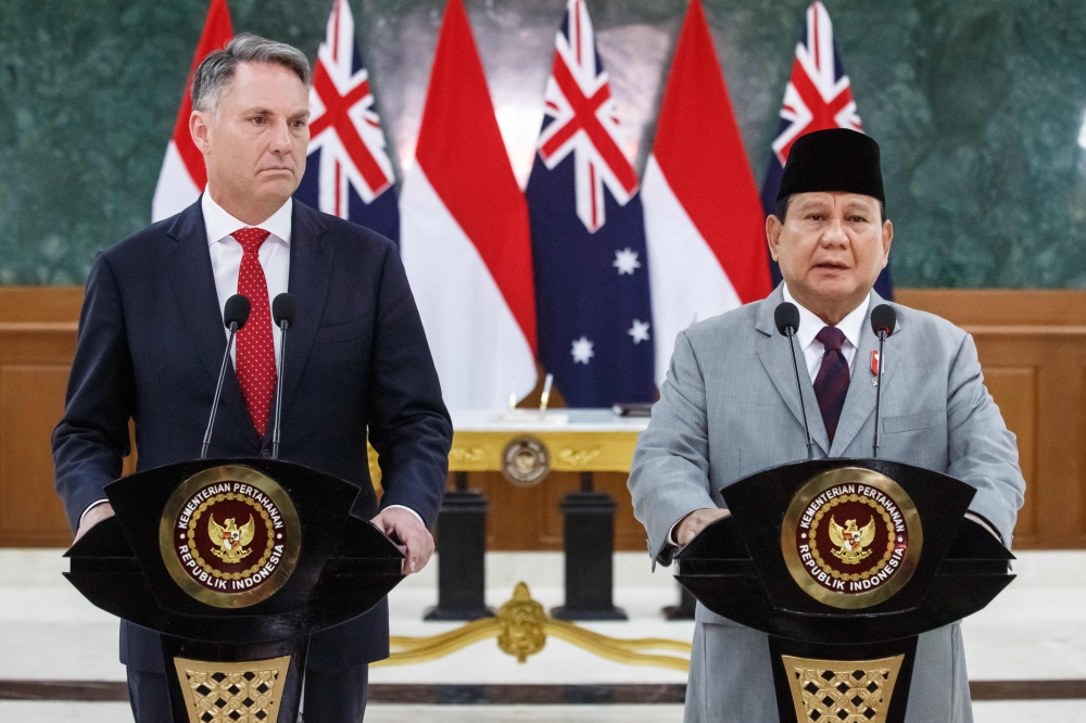 Indonesia's Defence Minister and president-elect Prabowo Subianto (R) and Australia's Deputy Prime Minister and Defence Minister Richard Marles hold a press conference after signing the Australia-Indonesia Defence Cooperation Agreement (DCA) at the Military Academy in Magelang, Central Java, on August 29, 2024. Photo by DEVI RAHMAN / AFP