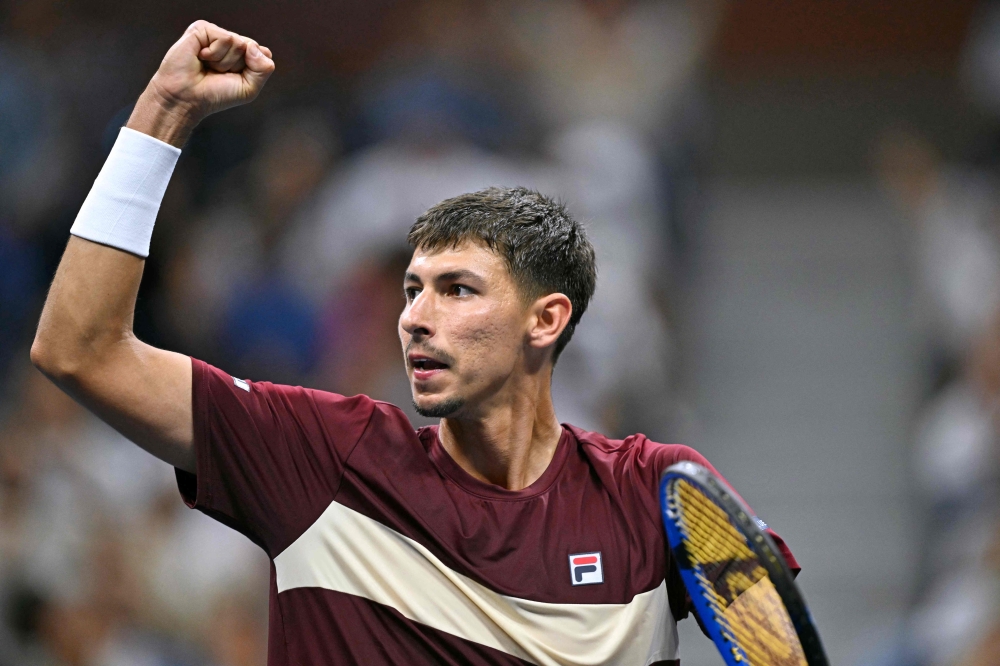 Australia's Alexei Popyrin celebrates after winning a game against Serbia's Novak Djokovic during their men's singles third round match on day five of the US Open tennis tournament at the USTA Billie Jean King National Tennis Center in New York City, on August 30, 2024. (Photo by ANGELA WEISS / AFP)