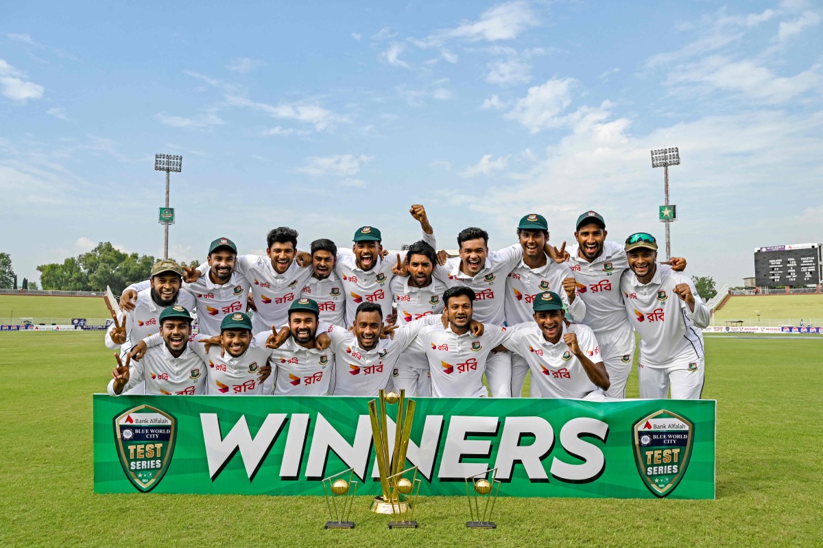 Bangladesh's players celebrate with trophy after winning the second and last Test cricket match between Pakistan and Bangladesh, at the Rawalpindi Cricket Stadium in Rawalpindi on September 3, 2024. (Photo by Aamir QURESHI / AFP)
