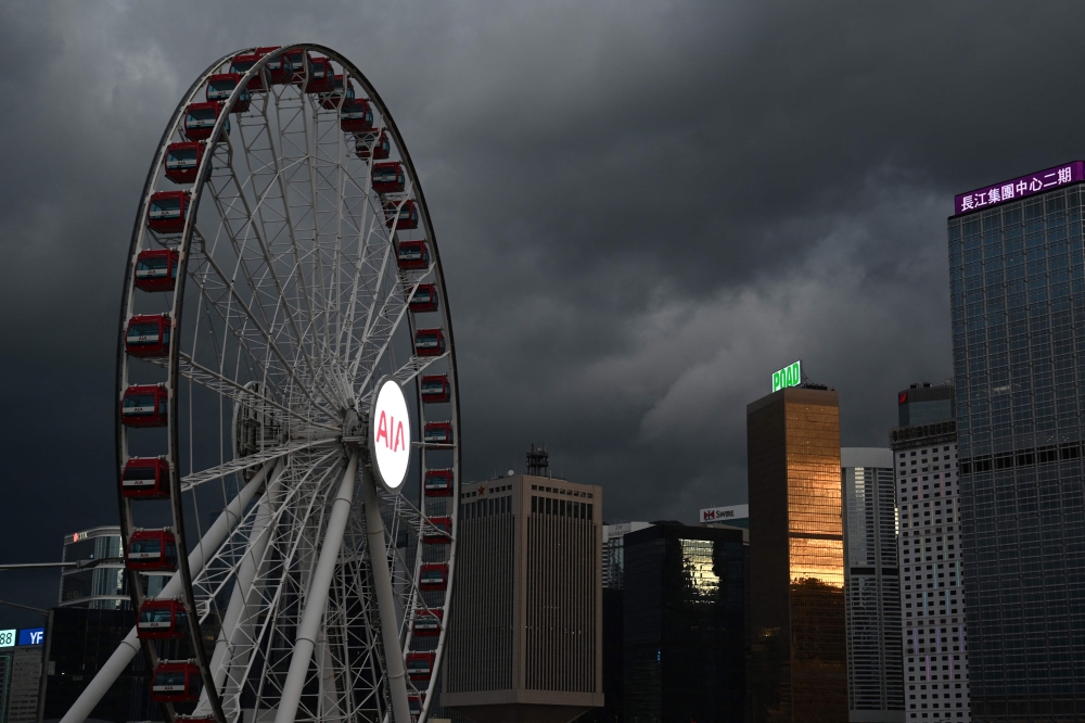 Storm clouds gather over buildings in Hong Kong on September 5, 2024, as super typhoon Yagi tracked across the South China Sea towards the southern China coast. (Photo by Peter PARKS / AFP)