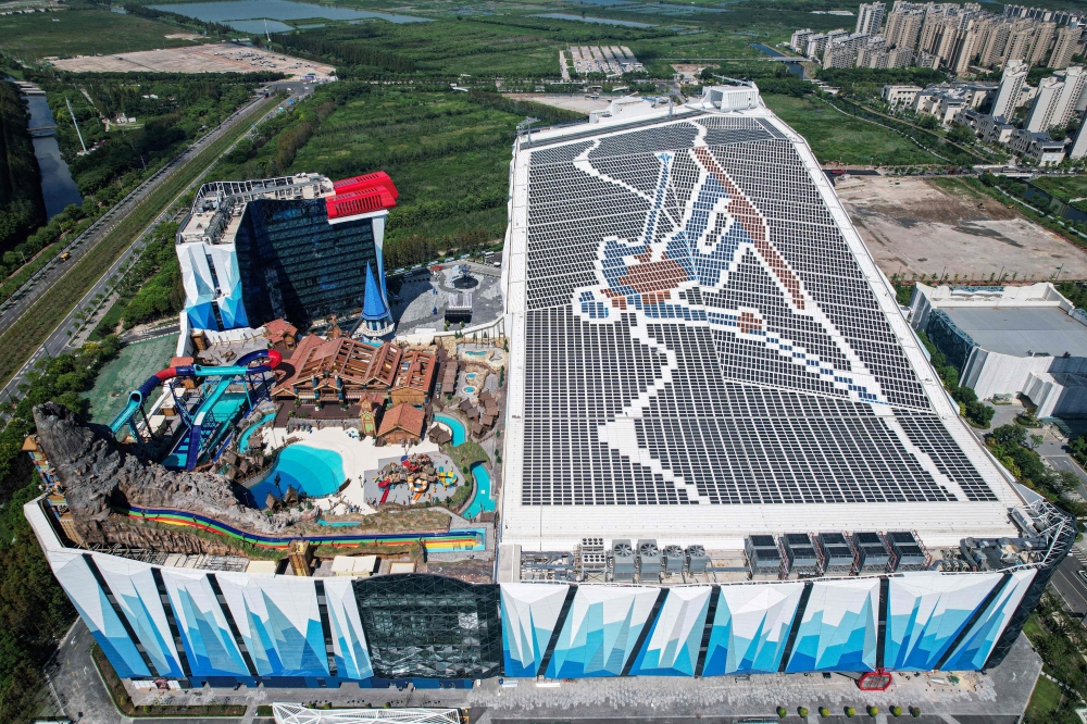 An aerial view shows the exterior view of the Shanghai L*SNOW Indoor Skiing Theme Resort, the world's largest indoor skiing resort during its official opening day in Shanghai on September 6, 2024. Photo by STRINGER / AFP