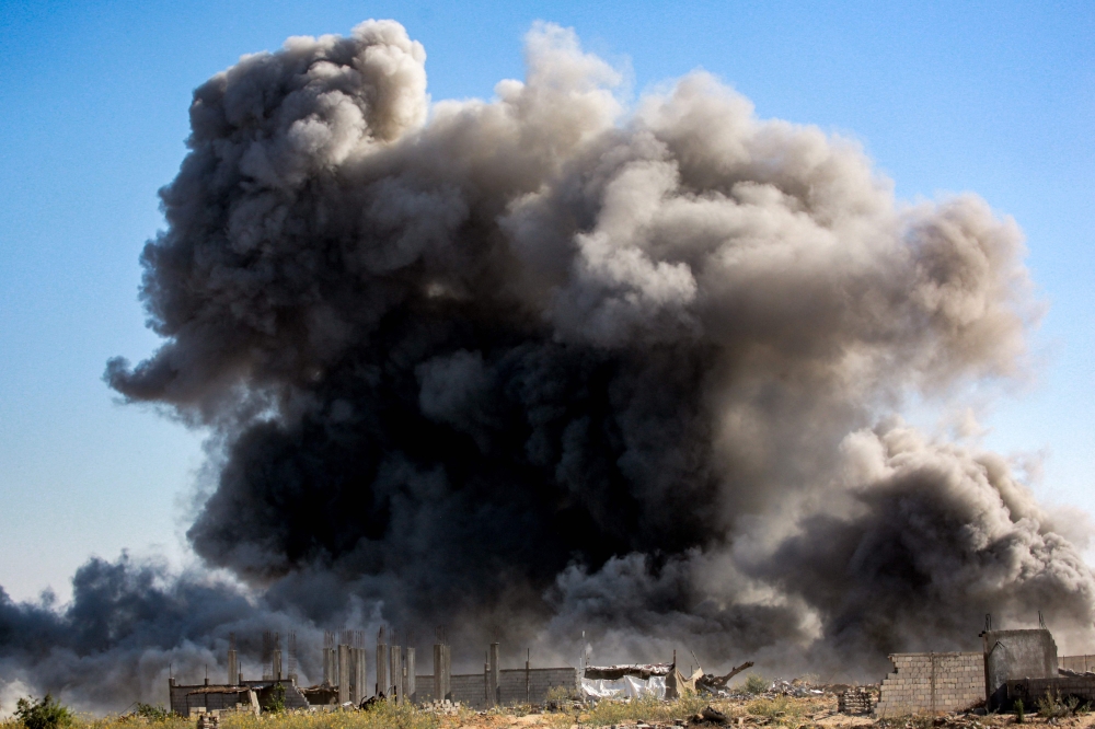 Smoke from Israeli bombardment rises in an area that was ordered to be evacuated by the Israeli army in the southeast of Khan Yunis in the southern Gaza Strip on September 8, 2024. (Photo by Bashar Taleb / AFP)