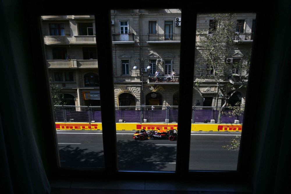 Red Bull Racing's Dutch driver Max Verstappen steers his car during the first practice session ahead of the Formula One Azerbaijan Grand Prix at the Baku City Circuit in Baku on September 13, 2024. (Photo by Andrej ISAKOVIC / AFP)