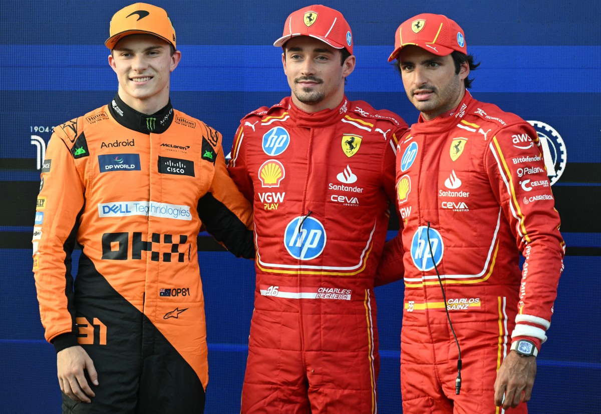 Pole position winner Ferrari's Monegasque driver Charles Leclerc (C) poses with second placed McLaren's Australian driver Oscar Piastri (L) and third placed Ferrari's Spanish driver Carlos Sainz after the qualifying session ahead of the Formula One Azerbaijan Grand Prix at the Baku City Circuit in Baku on September 14, 2024. Photo by Natalia KOLESNIKOVA / AFP.