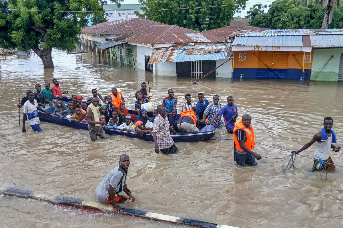 Photo used for demonstration purposes. People affected by floods are escorted through flood water on a military boat in Maiduguri on September 12, 2024. Photo by Audu MARTE / AFP.