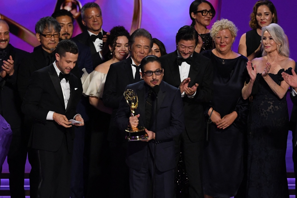 Japanese actor Hiroyuki Sanada (C), along with cast and crew, accept the Outstanding Drama Series award for “Shogun” onstage during the 76th Emmy Awards at the Peacock Theatre at L.A. Live in Los Angeles on September 15, 2024. (Photo by Valerie Macon / AFP)