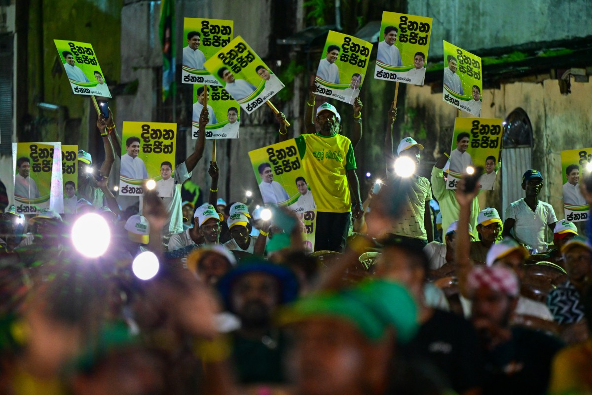 Supporters of Sri Lanka's Samagi Jana Balawegaya party leader and presidential candidate Sajith Premadasa, attend an election rally being addressed by him ahead of the upcoming presidential elections in Colombo on September 11, 2024. Photo by Ishara S. KODIKARA / AFP.