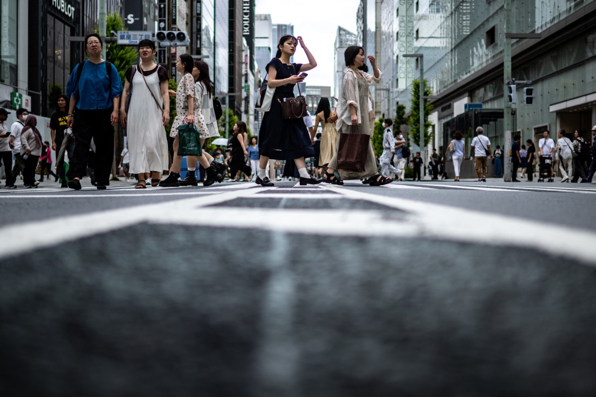 Photo used for demonstration purposes. People walk in the pedestrian zone of Tokyo's Ginza district during the 