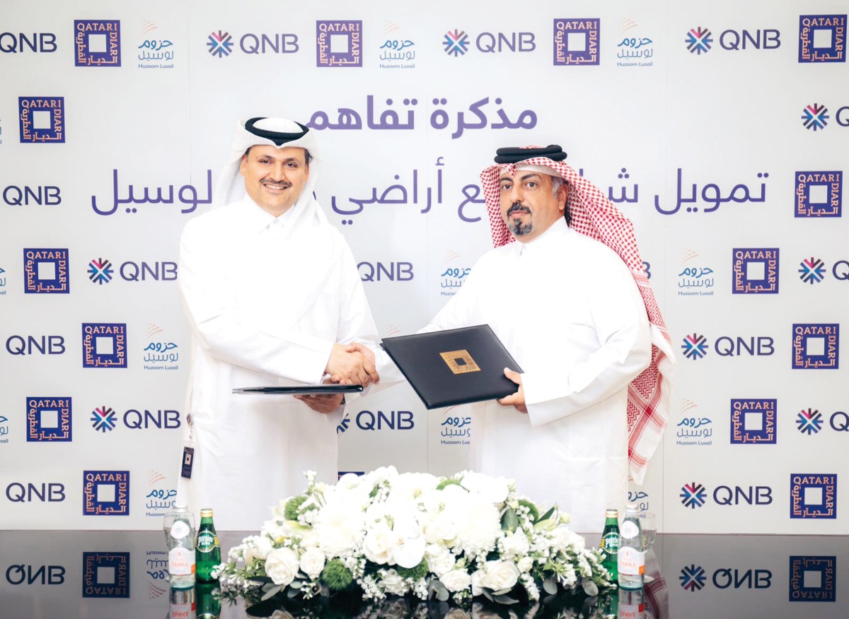 Eng. Fahad Abdullatif Al Jahrami, Chief Development and Asset Management Officer - Qatar at Qatari Diar and Adel Ali Al Malki, Senior Executive Vice President – Group Retail Banking at QNB Group during the agreement signing.