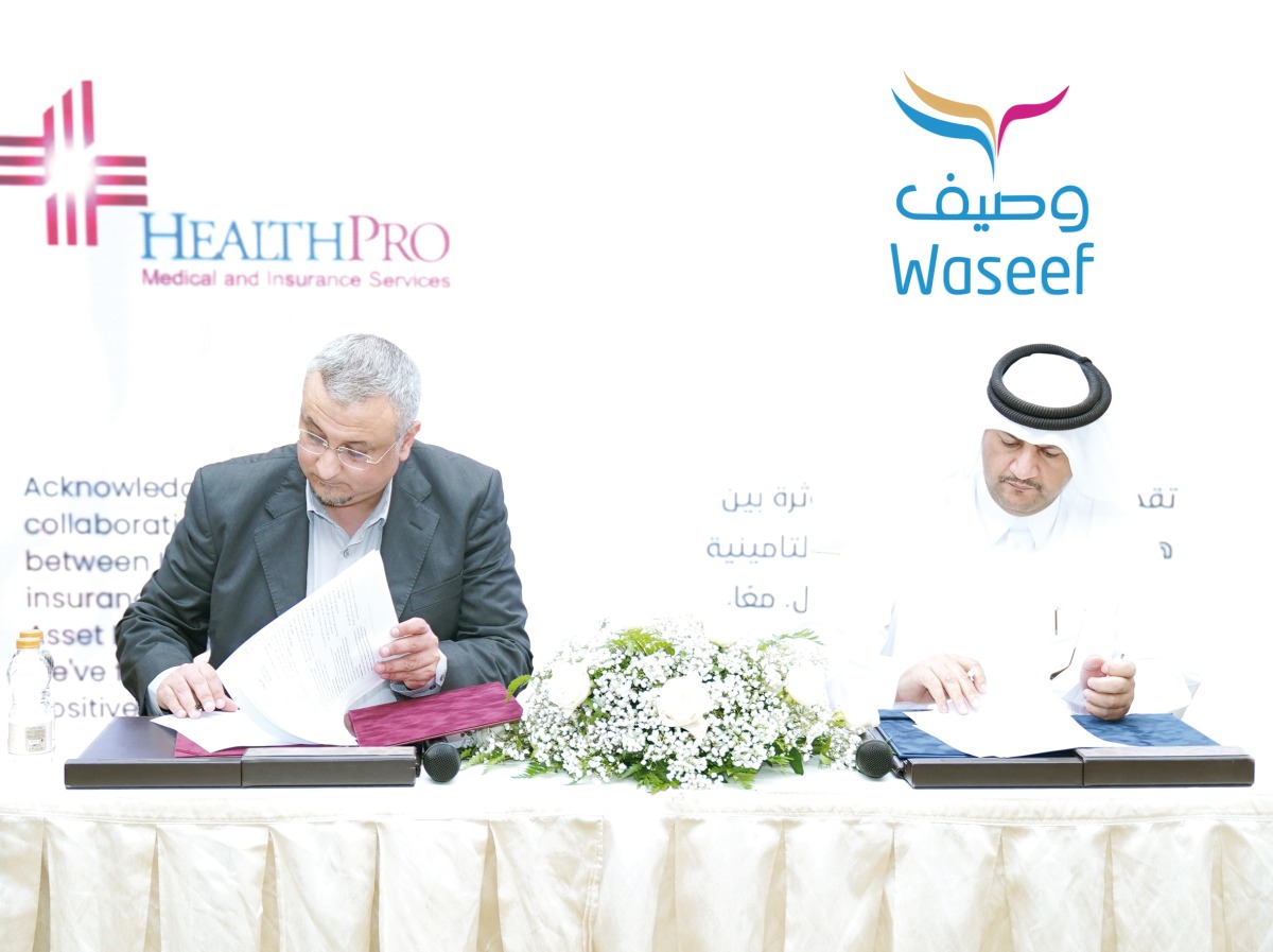 Khalifa Salman Al Mohannadi, Director of Support Services at Waseef, and Hani Youssef, General Manager of Health Pro for Medical and Insurance Services signing the agreement.