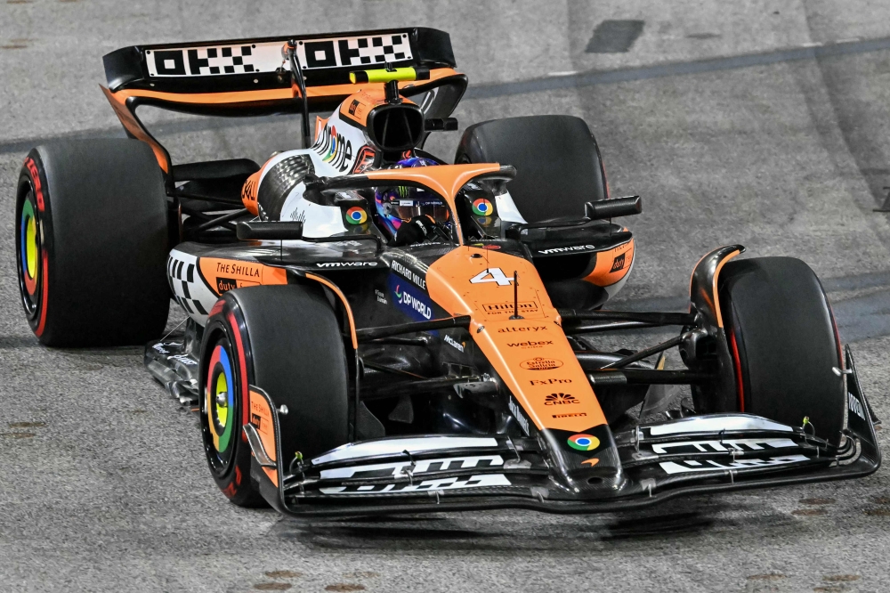 McLaren's British driver Lando Norris drives during the second practice session ahead of the Formula One Singapore Grand Prix night race at the Marina Bay Street Circuit in Singapore on September 20, 2024. (Photo by Roslan Rahman / AFP)