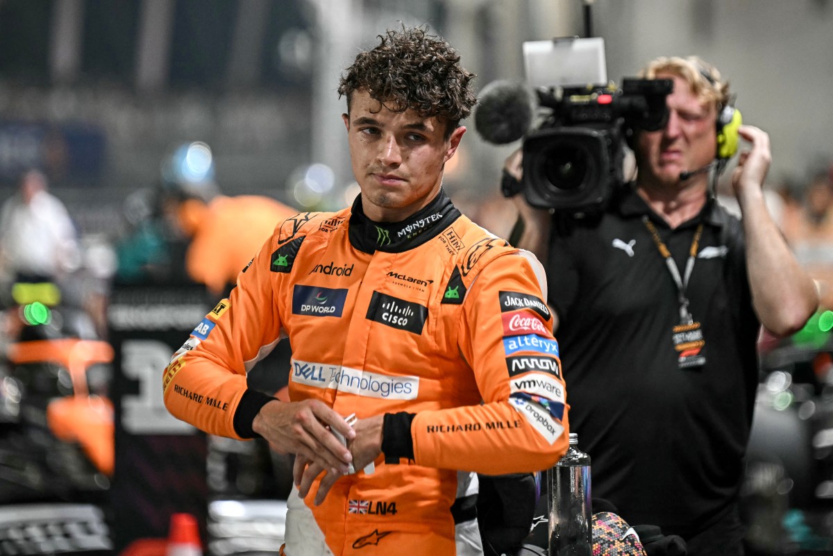 McLaren's British driver Lando Norris looks on after getting pole position in the qualifying session ahead of the Formula One Singapore Grand Prix night race at the Marina Bay Street Circuit in Singapore on September 21, 2024. Photo by Lillian SUWANRUMPHA / AFP.