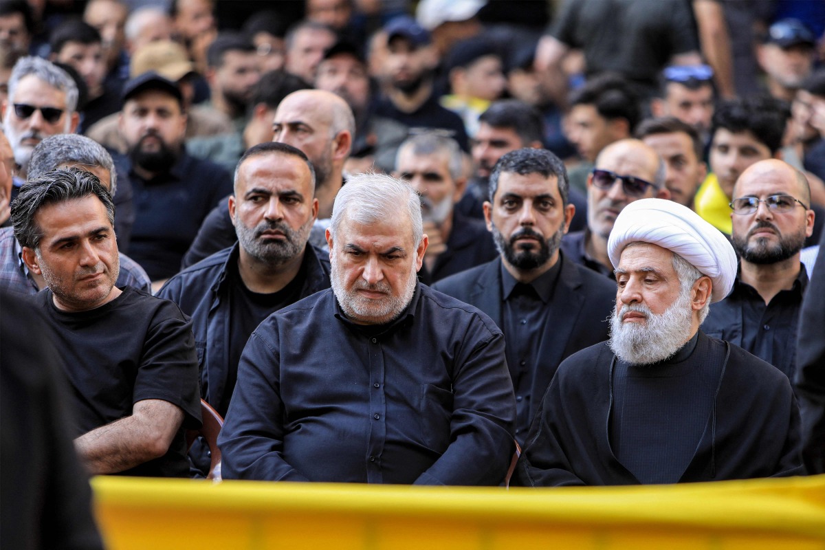  Naim Qassem (R), deputy secretary-general of Hezbollah, and Mohammed Raad (C), head of Hezbollah's bloc in the Lebanese parliament, attend the funeral of top Hezbollah military commander Ibrahim Aqil in Beirut's southern suburbs on September 22, 2024.(Photo by AFP)