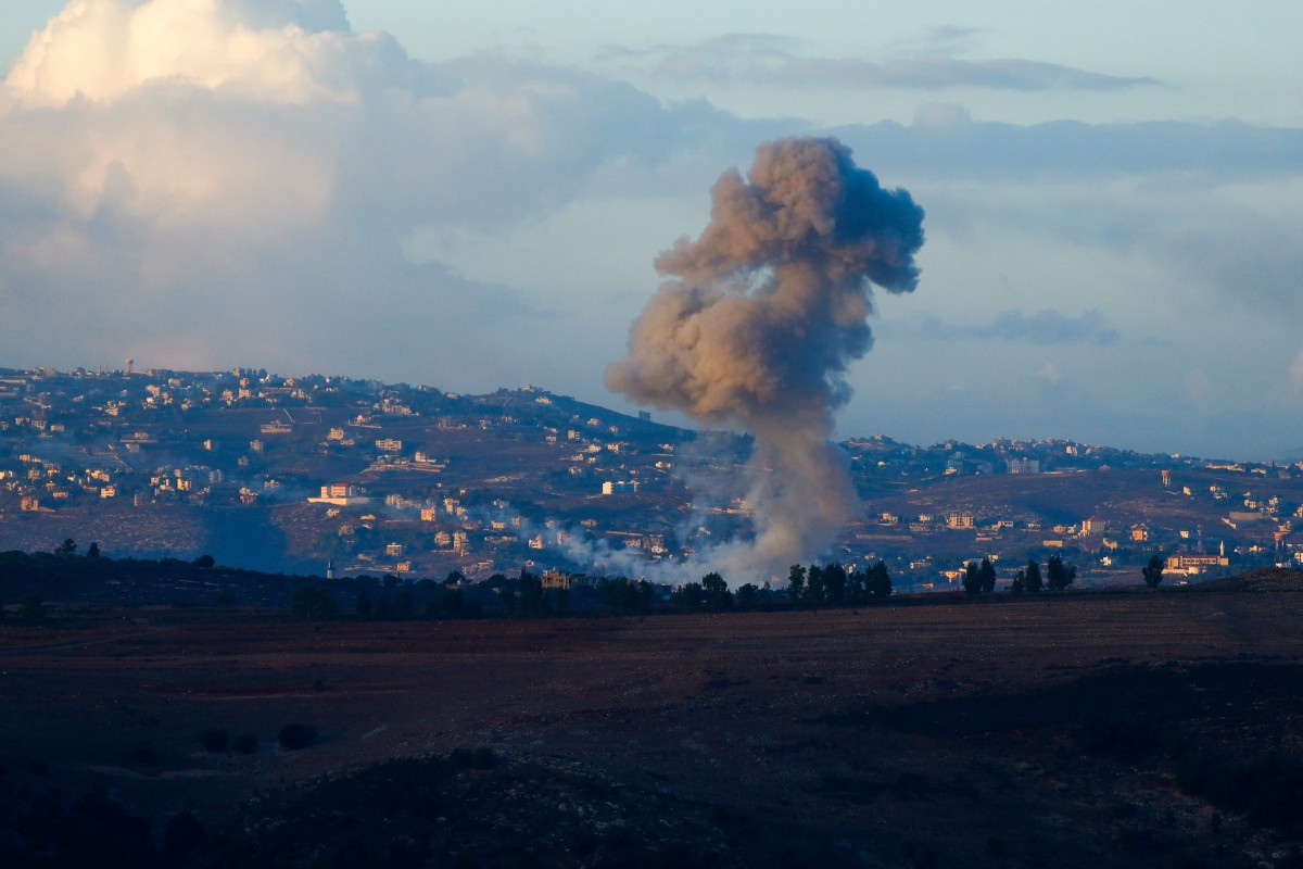 Smoke billows from the site of an Israeli airstrike in Adshit, near the Lebanon-Israel border, on September 23, 2024. Photo by Ammar Ammar / AFP.