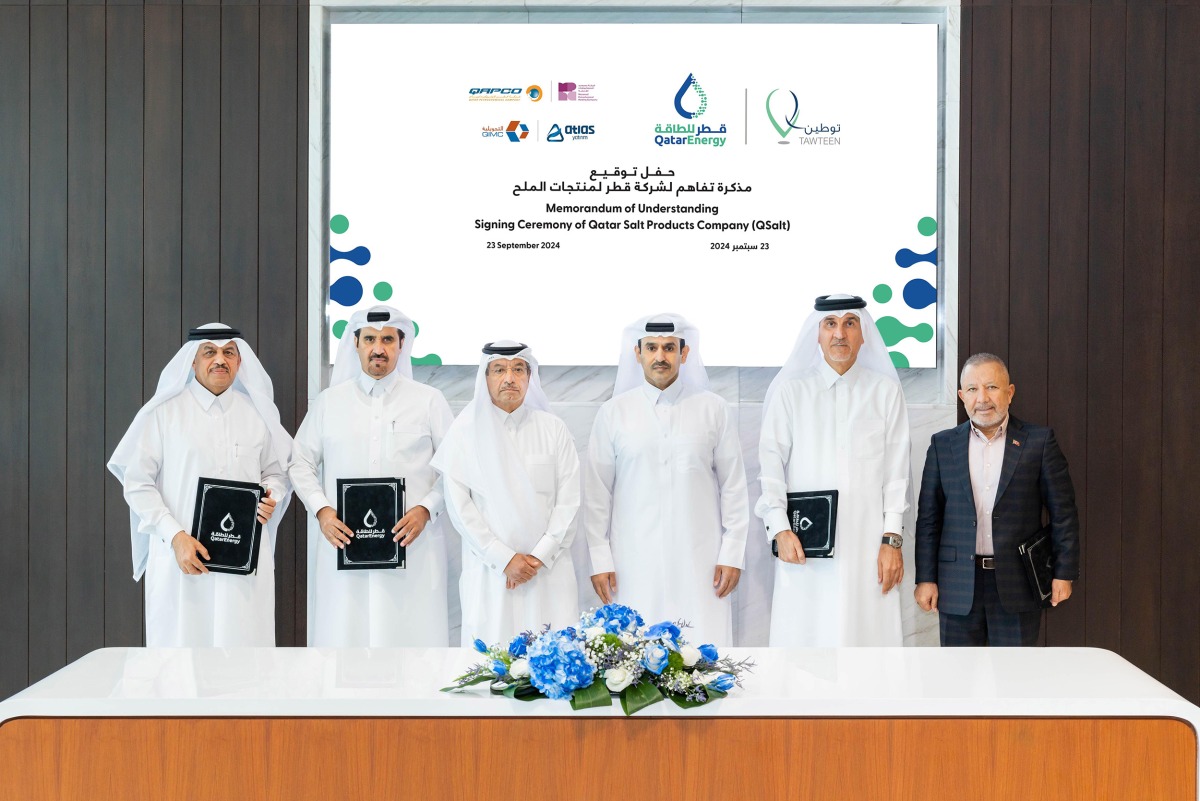 Minister of State for Energy Affairs and President and CEO of QatarEnergy, H E Saad Sherida Al Kaabi (third right) with officials of participating companies at the MoU signing ceremony yesterday.