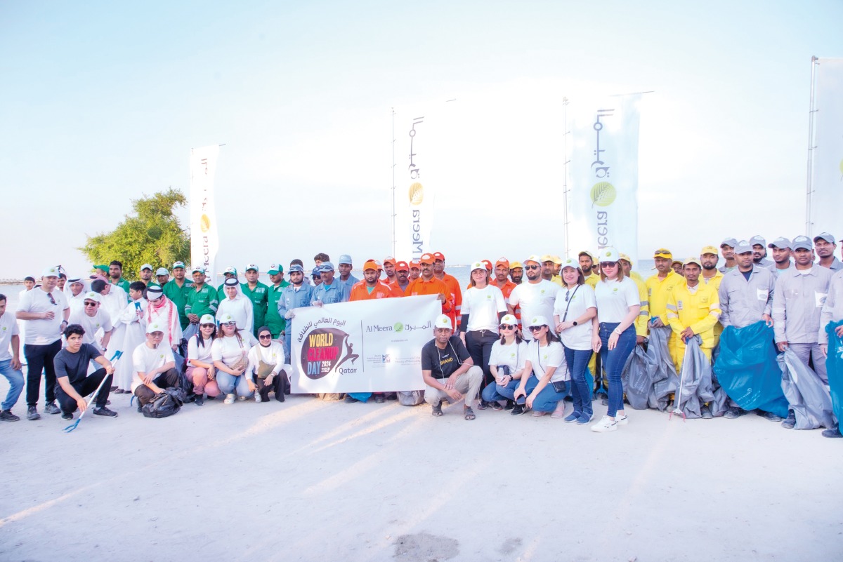 Participants take a group photo during World Cleanup Day event organised by Al Meera.