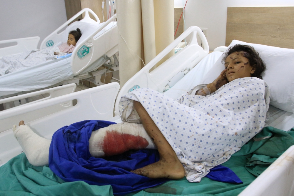 Children, wounded in Israeli strikes on their village, receive treatment in the southern Lebanese village of Saksakiyeh on September 24, 2024. (Photo by Mahmoud Zayyat / AFP)