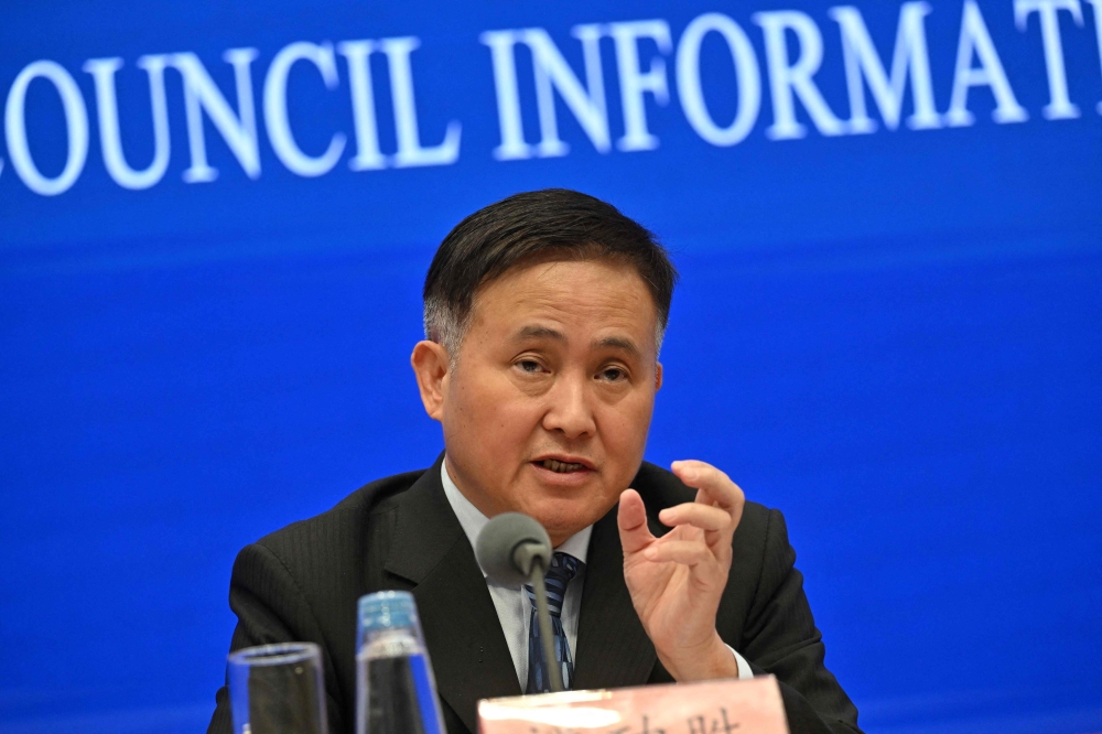 Pan Gongsheng, Governor of the People's Bank of China, speaks during a press conference at the China's State Council Information office in Beijing on September 24, 2024. (Photo by Adek Berry / AFP)