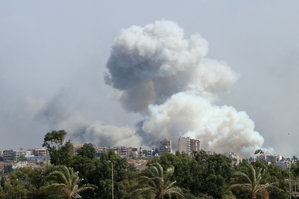 Smoke billows from a site targeted by Israeli shelling in the southern Lebanese village of Burj el-Shmali on September 23, 2024. (Photo by Bilal Kashmar / AFP)

