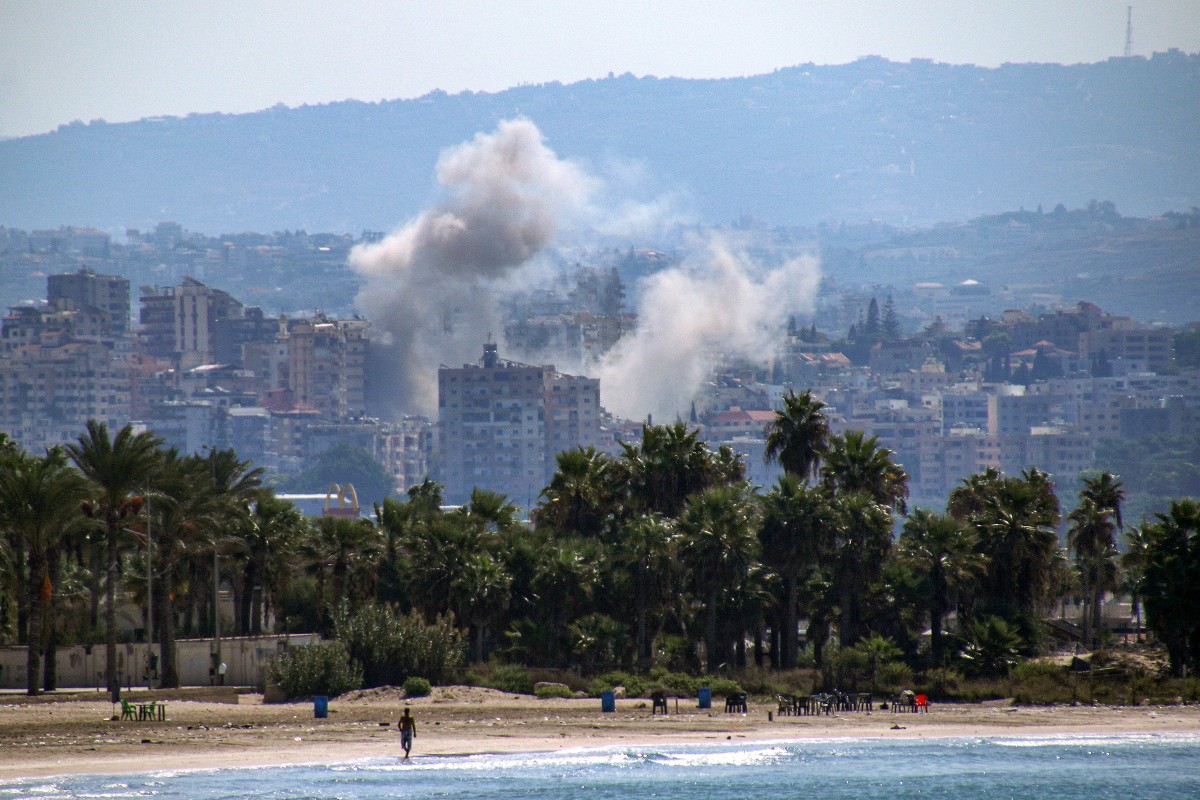 A cloud of smoke erupts during Israeli air strikes on a village south of Tyre in southern Lebanon on September 25, 2024. Photo by Hasan FNEICH / AFP.