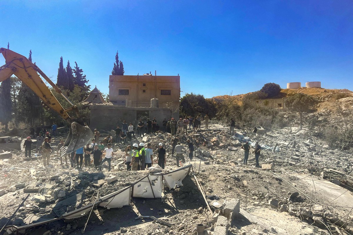 People check the rubble of destroyed buildings in Lebanon's Bekaa Valley village of Younine on September 26, 2024. (Photo by AFP)