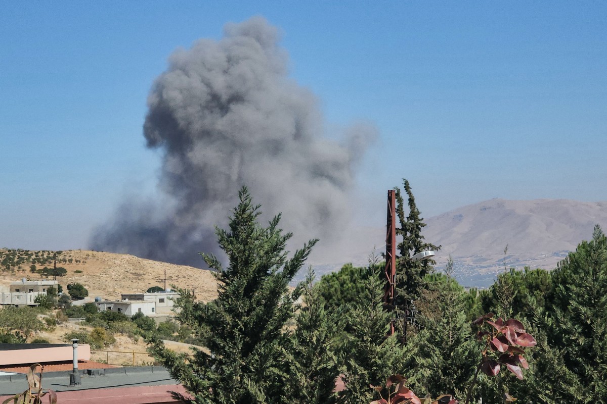 Smoke billows from the site of an Israeli airstrike that targeted the village of Harabta in Lebanon's eastern Bekaa Valley on September 27, 2024. Photo by AFP.