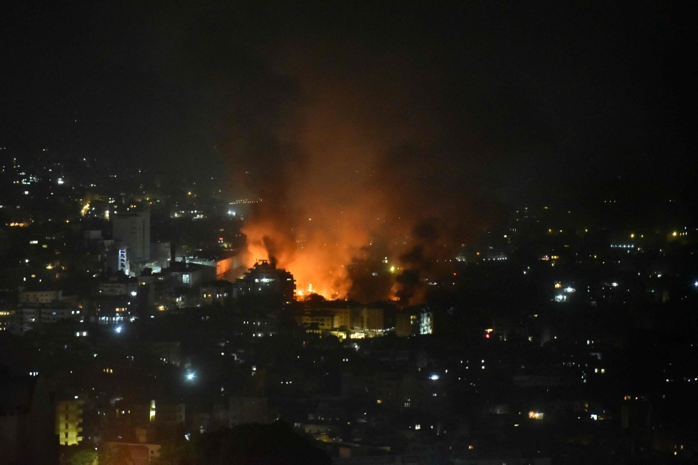 Smoke billows from the site of an Israeli airstrike that targeted a neighborhood in Beirut's southern suburb early on September 28, 2024. (Photo by Fadel Itani / AFP)