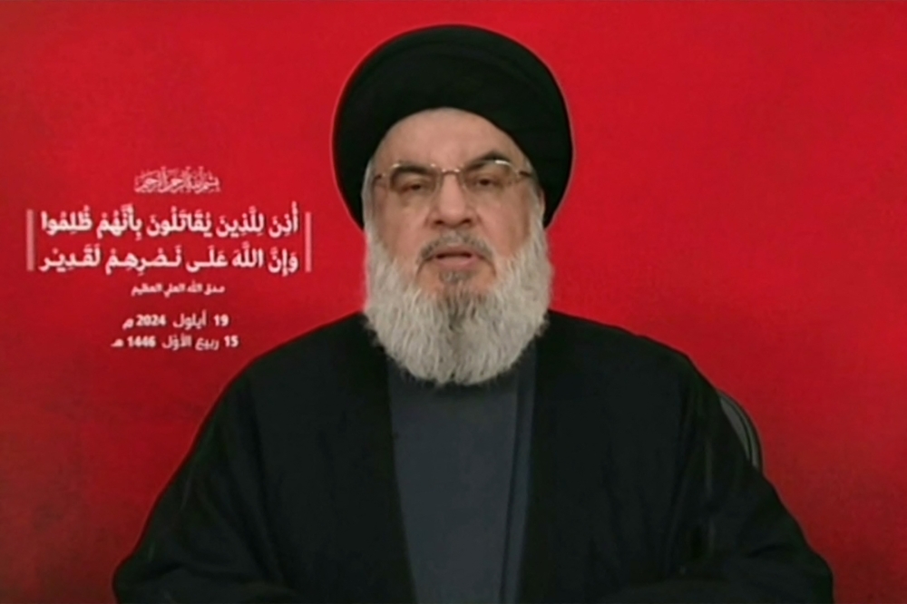 (Files) An image grab taken from Hezbollah's Al-Manar TV shows the Lebanese group's chief Hassan Nasrallah addressing the nation from an undisclosed location on September 19, 2024. (Photo by Al-Manar / AFP) 