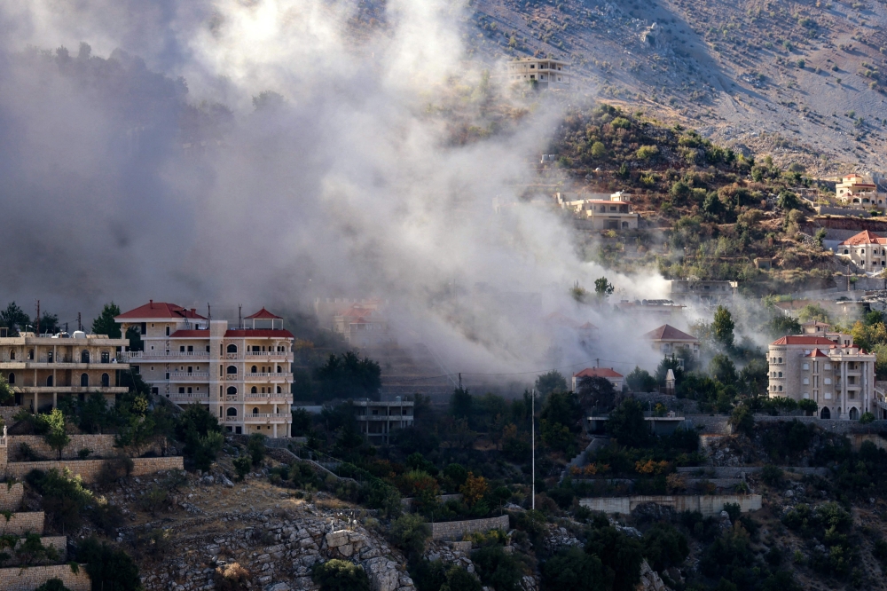 Smoke billows from the site of an Israeli airstrike that targeted the southern Lebanese border village of Shebaa on September 28, 2024. (Photo by Rabih Daher/ AFP)