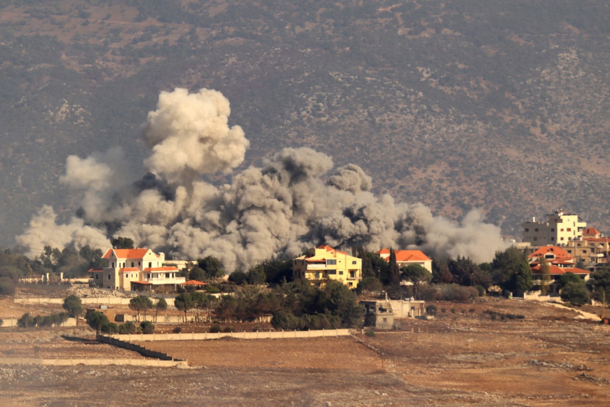 Smoke rises from the site of an Israeli airstrike that targeted the southern Lebanese village of Khiam on September 28, 2024. (Photo by Rabih DAHER / AFP)
