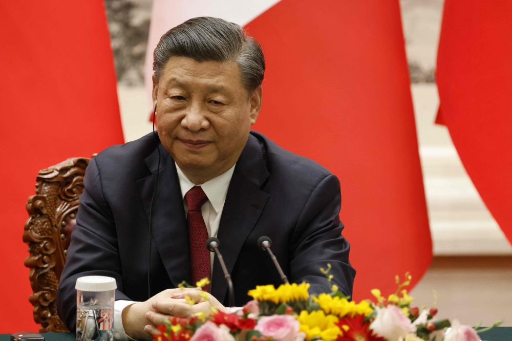 China's  President Xi Jinping attends a joint press conference with French President Emmanuel Macron (not pictured) in Beijing on April 6, 2023. (Photo by LUDOVIC MARIN / AFP)

