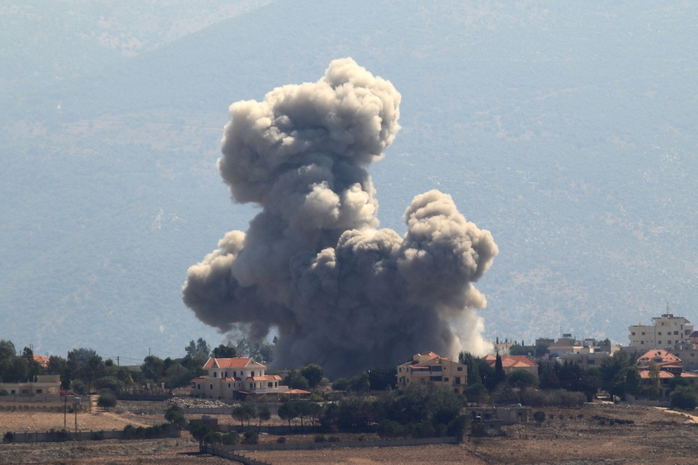 Smoke rises from the site of an Israeli airstrike that targeted the southern Lebanese village of Khiam on September 30, 2024. (Photo by Rabih Daher / AFP)