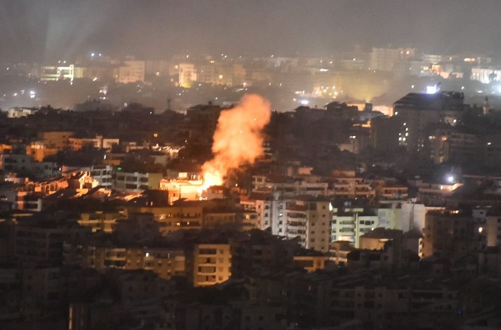 Smoke rises from the site of an Israeli airstrike that targeted a neighborhood in Beirut's southern suburb early on October 1, 2024. (Photo by Fadel Itani / AFP)