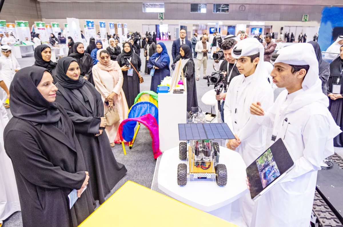 Minister of Education and Higher Education H E Buthaina bint Ali Al Jabr Al Nuaimi (left) visiting the exhibition showcasing research projects by pre-university students.