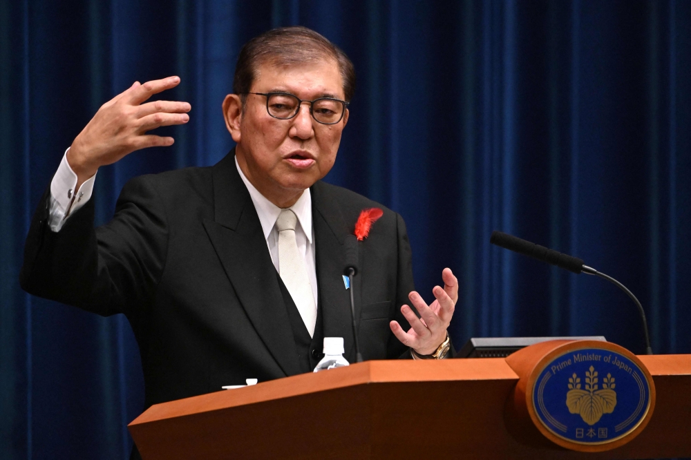 Japan's new Prime Minister Shigeru Ishiba speaks during a press conference at the prime minister's office in Tokyo on October 1, 2024. (Photo by Yuichi YAMAZAKI / POOL / AFP)