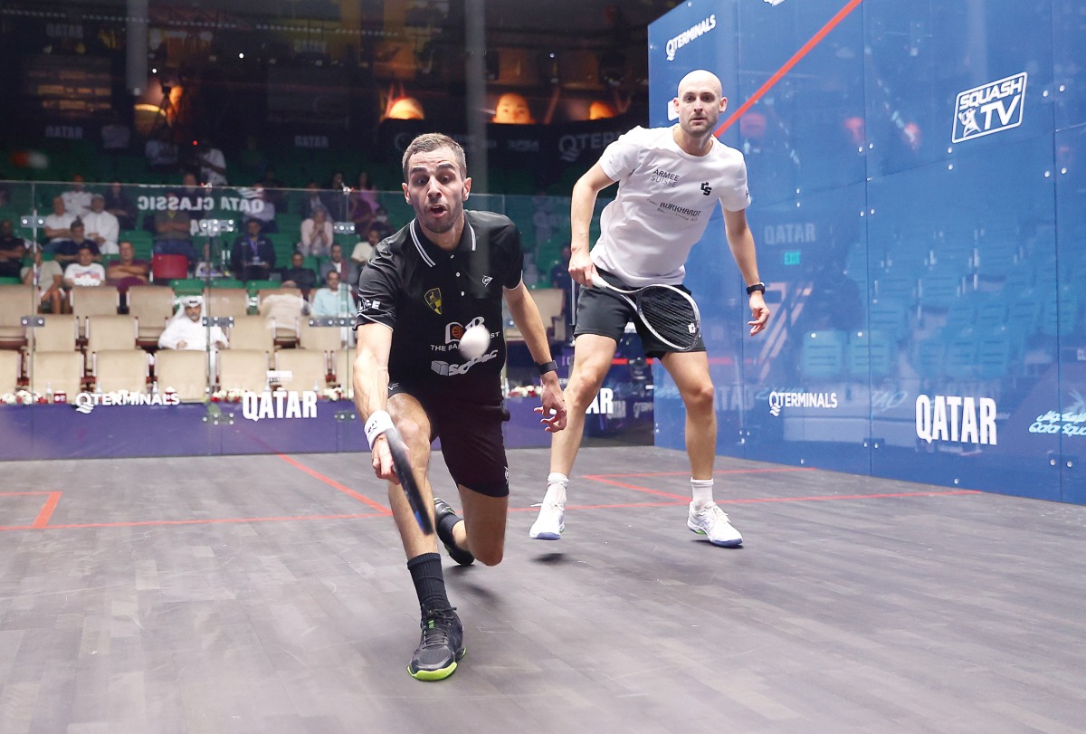 Ali Farag (left) in action against Nicolas Mueller during their quarter-final yesterday. 