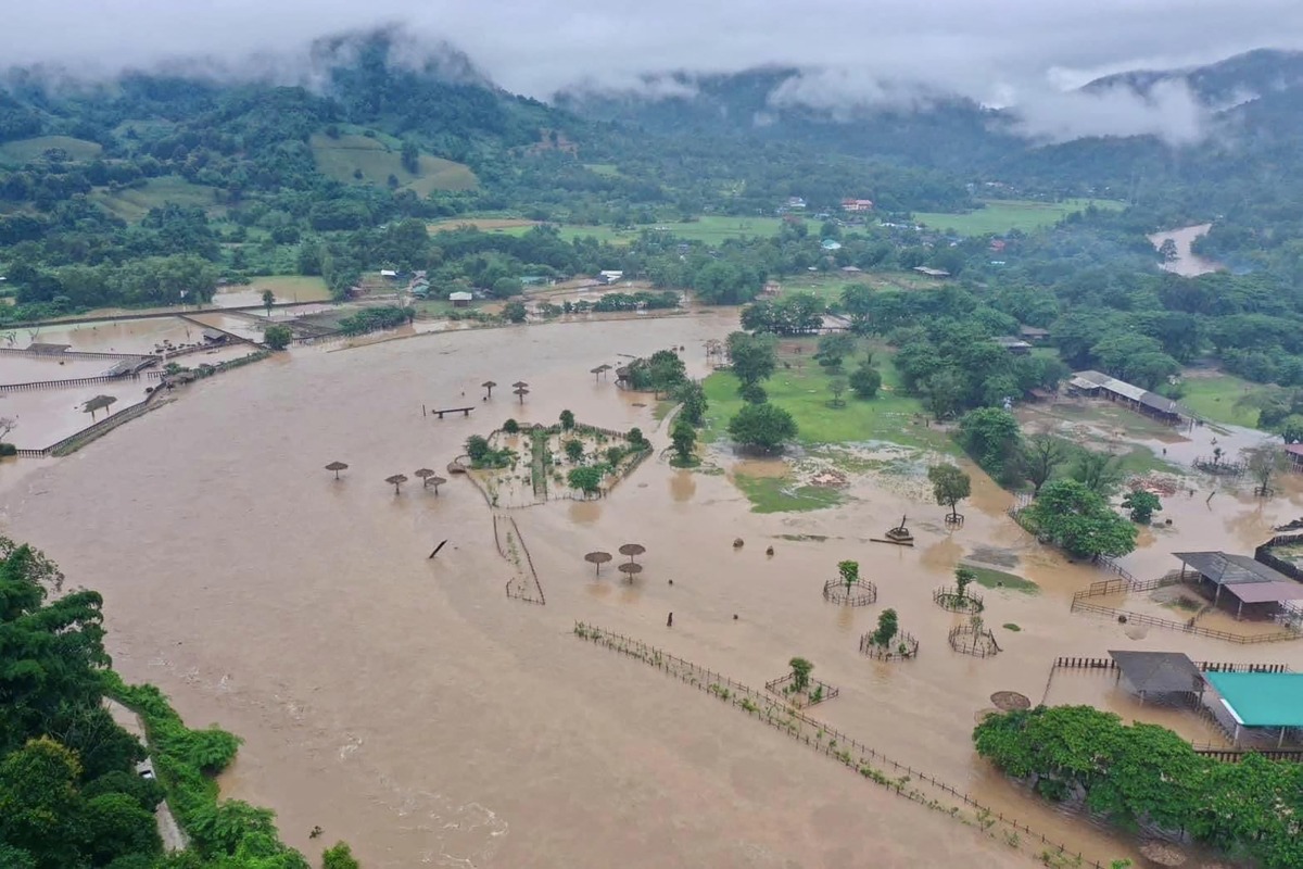 This aerial handout photo taken and released on October 3, 2024 by the Elephant Nature Park shows flood waters submerging the sanctuary in Thailand's northern Chiang Mai province. (Photo by Handout / Elephant Nature Park / AFP) 