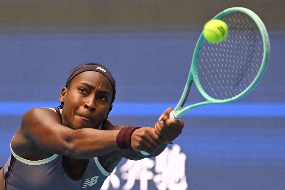 USA's Coco Gauff hits a return to Spain's Paula Badosa during their women's singles semifinal match at the China Open tennis tournament in Beijing on October 5, 2024. (Photo by Greg Baker / AFP)