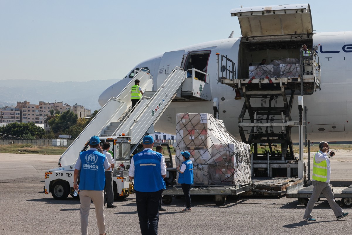 Photo used for demonstration purposes. Ground staff unload a medical aid shipment provided by the World Health Organization (WHO) and the United Nations High Commissioner for Refugees (UNHCR), from a plane at the Beirut International Airport on October 4, 2024. Photo by IBRAHIM AMRO / AFP.