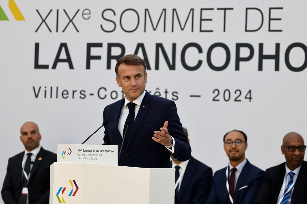 France's President Emmanuel Macron delivers a speech during the closing session of the 19th Summit of the Francophonie at the Grand Palais in Paris, on October 5, 2024. (Photo by Ludovic MARIN / POOL / AFP)
