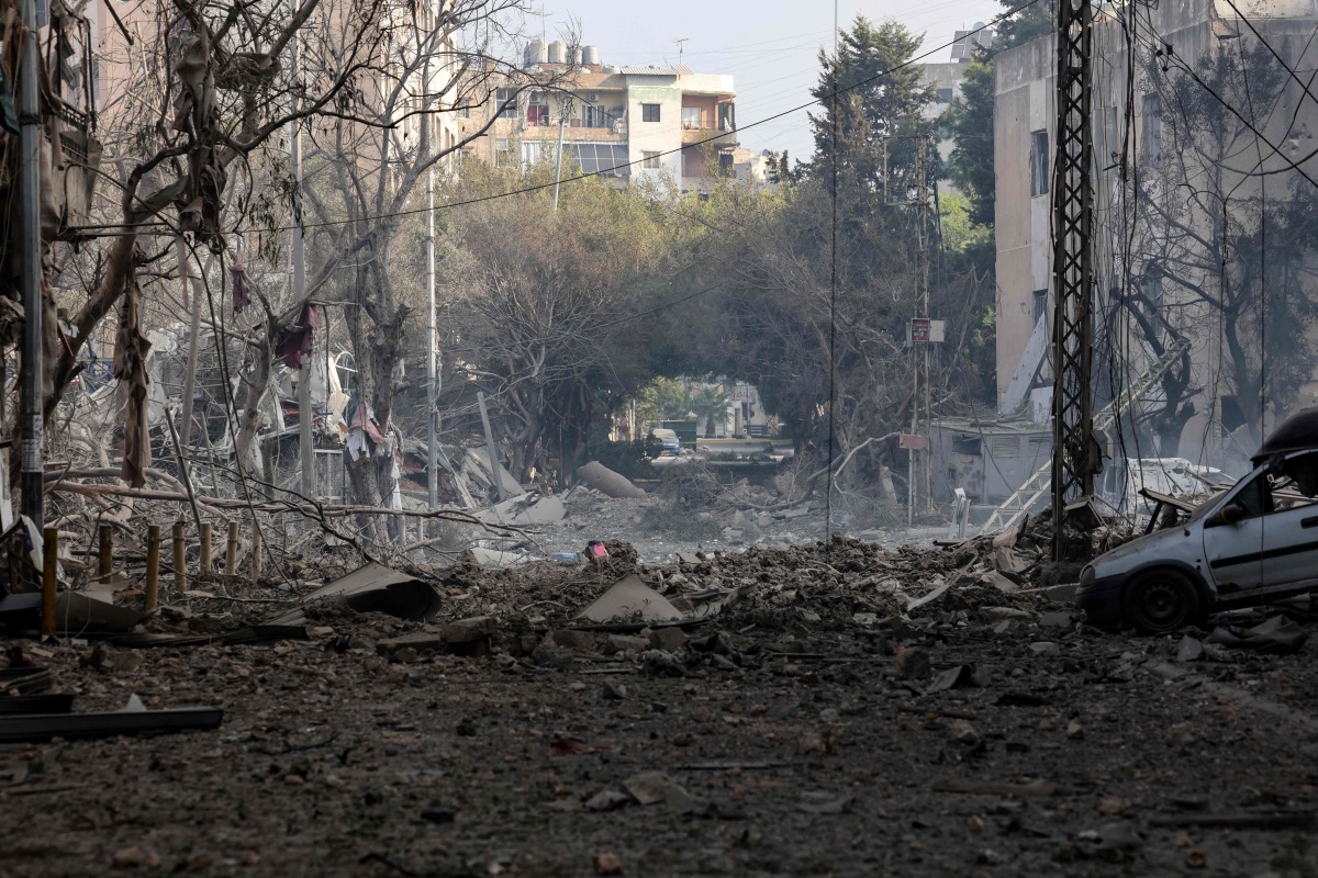 Rubble is scattered along a street in the aftermath of Israeli airstrikes on the Mreijeh neighbourhood in Beirut's southern suburbs on October 6, 2024. (Photo by ANWAR AMRO / AFP)
