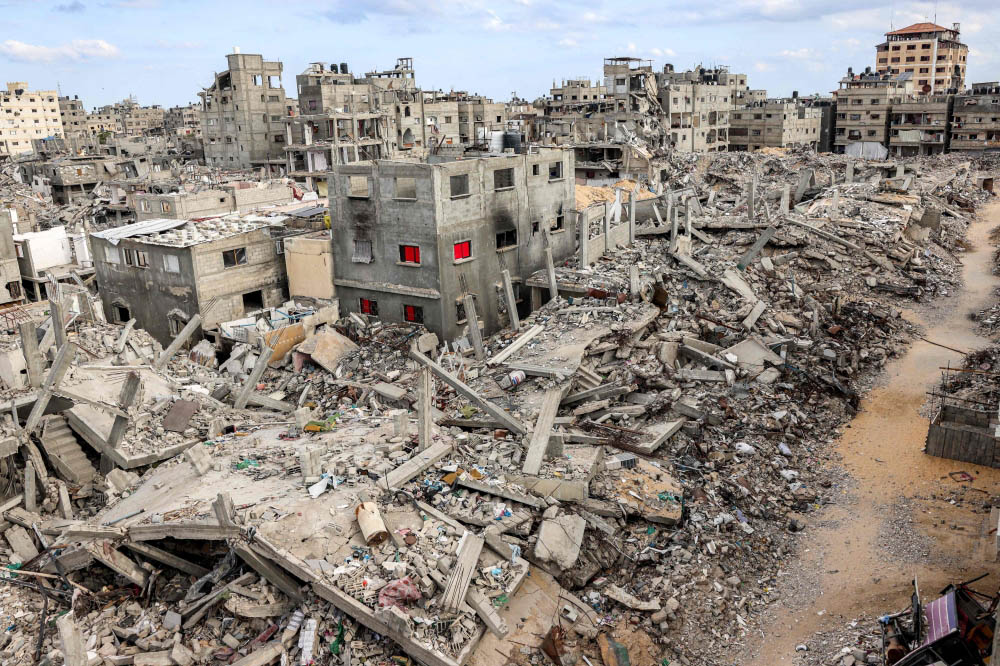 This overview shows destroyed buildings in Khan Yunis in the southern Gaza Strip on October 7, 2024. (Photo by Bashar Taleb / AFP)