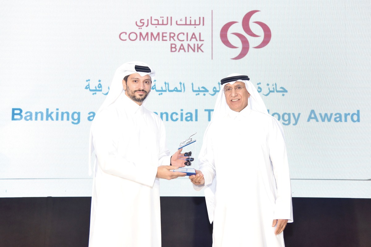 EGM, Chief Wholesale and International Banking Officer at Commercial Bank, Fahad Badar receiving the award from UDST President Dr. Salem Al Naemi.