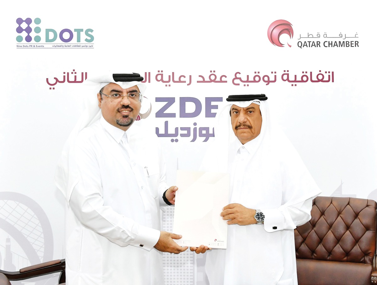 QC Acting General Manager, Ali Saeed Bu Sherbak Al Mansori, and the CEO of Nine Dots Group, Abdulaziz Al Isaac during the signing ceremony.