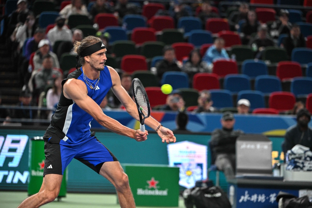 Germany's Alexander Zverev hits a return to Netherlands' Tallon Griekspoor during their men's singles match at the Shanghai Masters tennis tournament in Shanghai on October 8, 2024. (Photo by HECTOR RETAMAL / AFP)