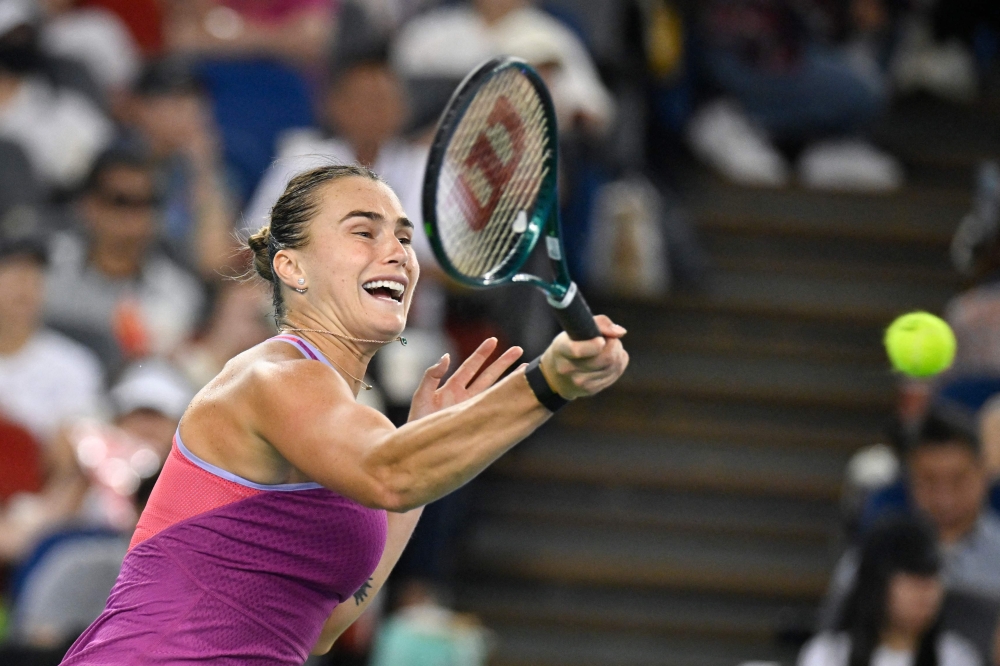 Belarus's Aryna Sabalenka hits a return against USA's Coco Gauff at the Wuhan Open tennis tournament on October 12, 2024. (Photo by WANG Zhao / AFP)