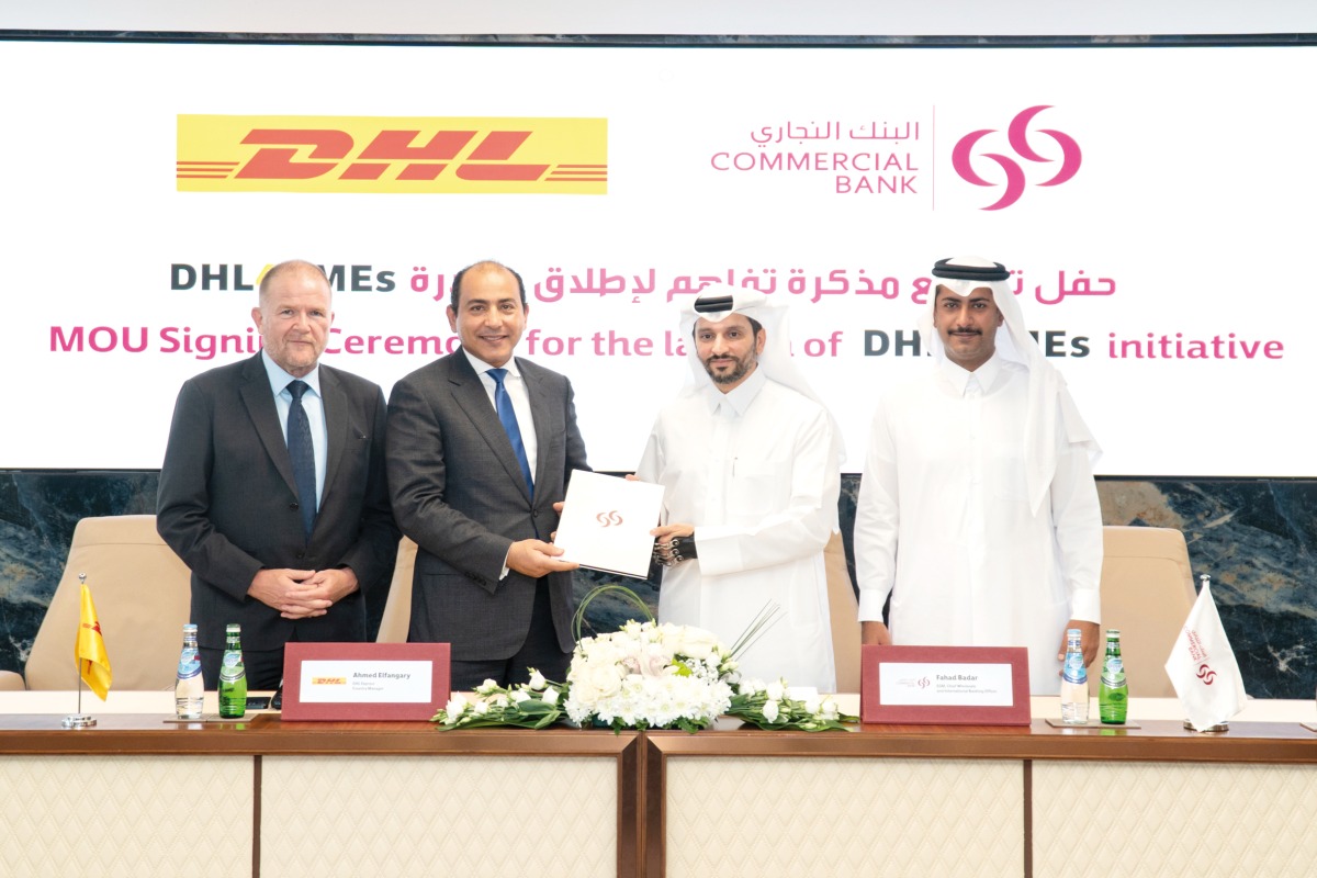 Commercial bank and DHL officials during the signing ceremony.