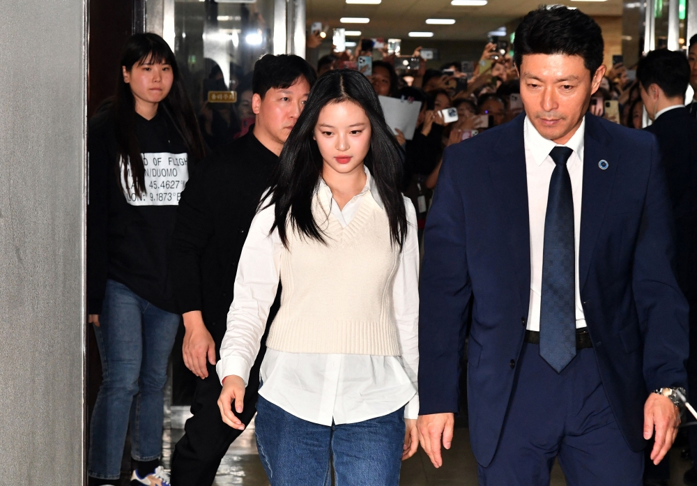 New Jeans' Hanni (C) arrives to testify at the National Assembly in Seoul on October 15, 2024. Photo by KIM Min-Hee / AFP