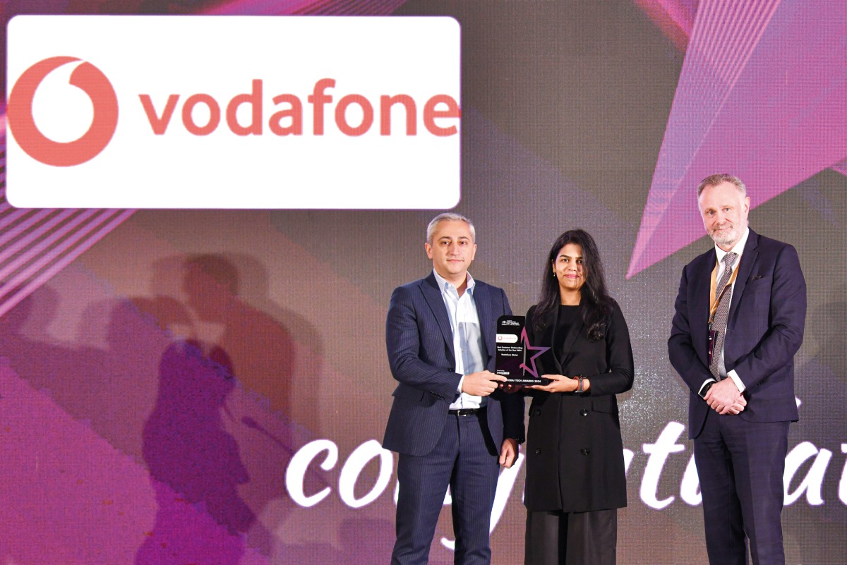 A Vodafone official receiving the award during the event.